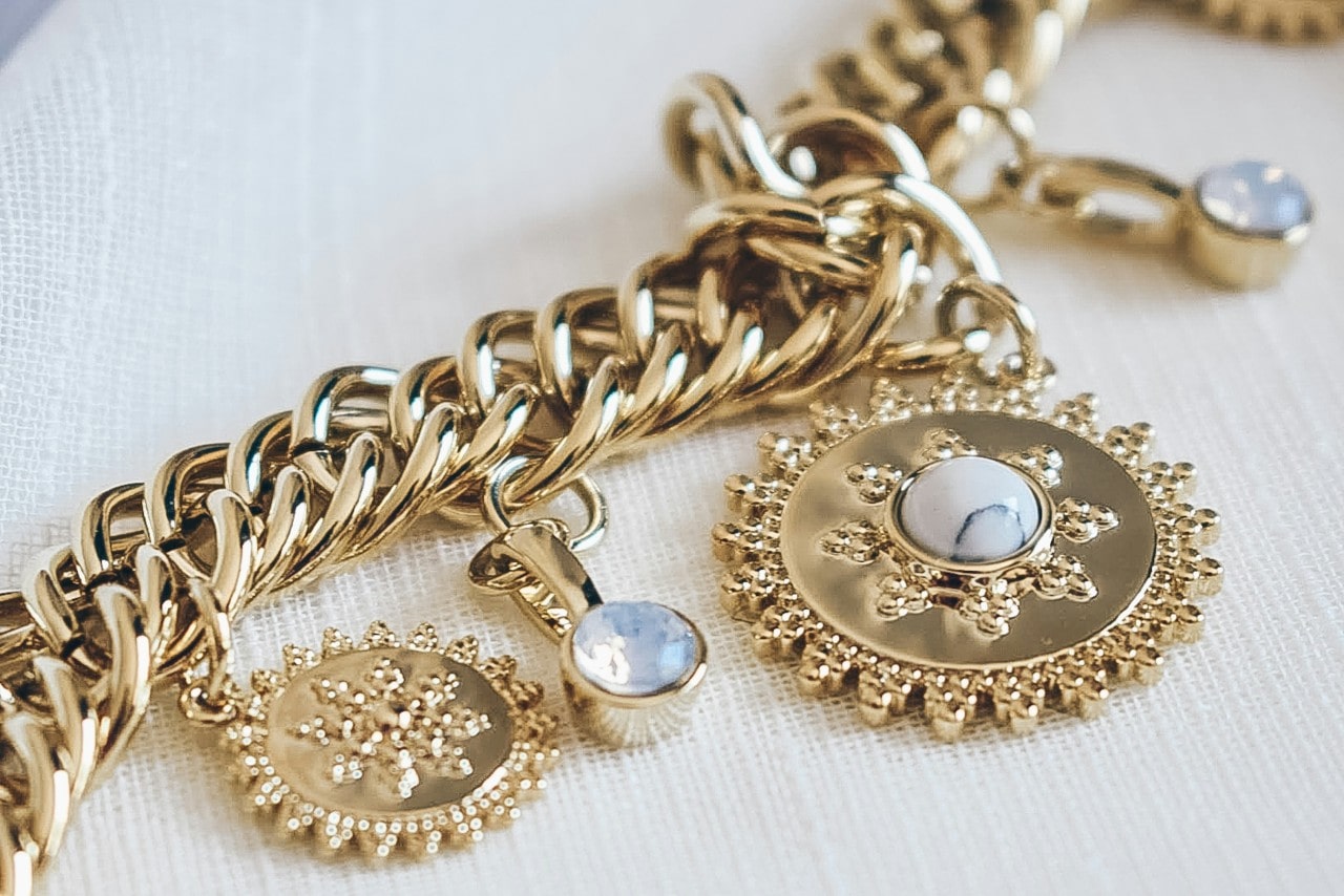 Close‑up of a gold link bracelet.